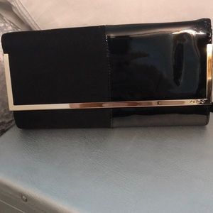 Black suede and patent leather clutch bag